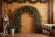 Fond photo Pomme de pin dorée de la collection Arches Noël 2026 - planches miel, sapin et accents dorés - séance famille Noël cocooning